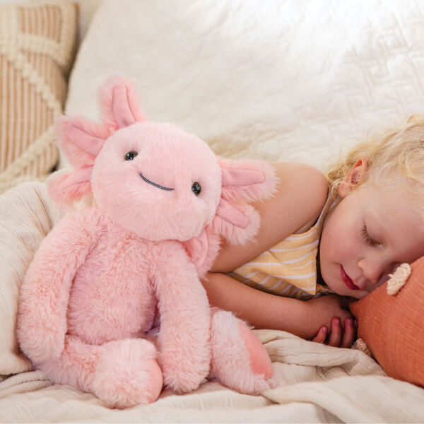15" Buddy Axolotl - Front view of pink Axolotl weighted stuffed animal with sleeping child in a bedroom image number 7
